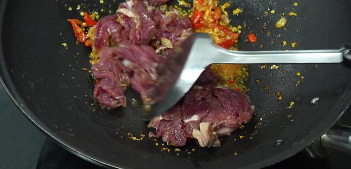 Add basil leaves and stir-fry until cooked.
