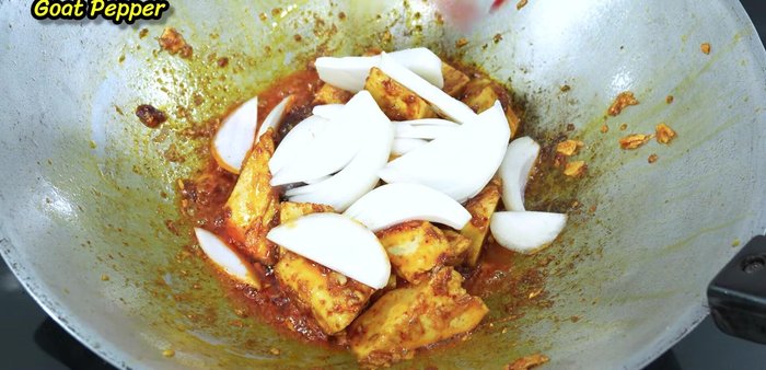 Add onion and sliced chili peppers. Stir-fry until onions are cooked.