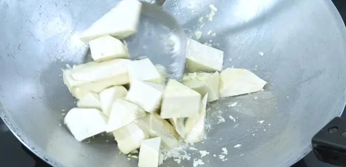 Add tofu and stir-fry.