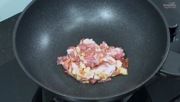 Stir-fry the pork: Heat a pan, add the marinated pork, and stir-fry until browned and slightly crispy.