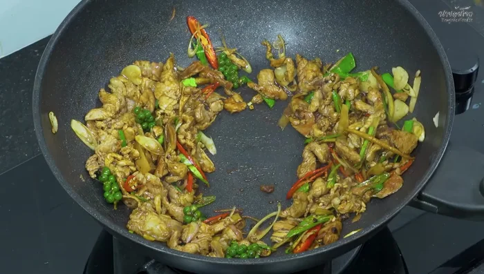 Add basil: Add the basil leaves and stir-fry until wilted.