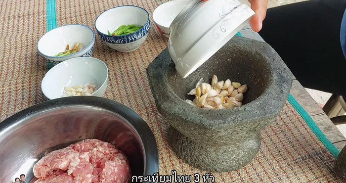 Pound 3 cloves of Thai garlic. This will be used for frying later.