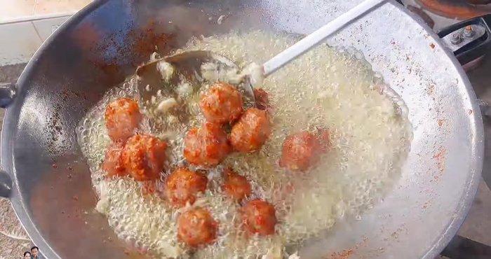 Fry until golden yellow. Add the pounded garlic and fry until crispy. Add green chilies, if desired.