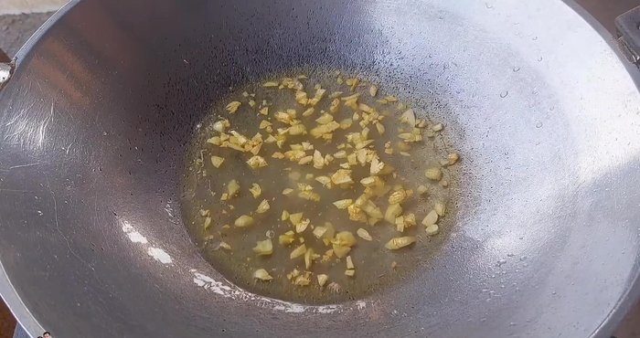 Add water, soy sauce, oyster sauce, sweet soy sauce (optional), vinegar, chili powder (optional), and MSG (optional). Adjust seasoning to your preference.