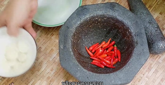 Pound the chili and garlic together.