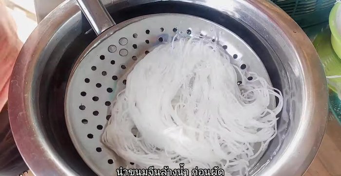 Prepare the rice noodles by washing them thoroughly to prevent sticking and tangling during stir-frying.