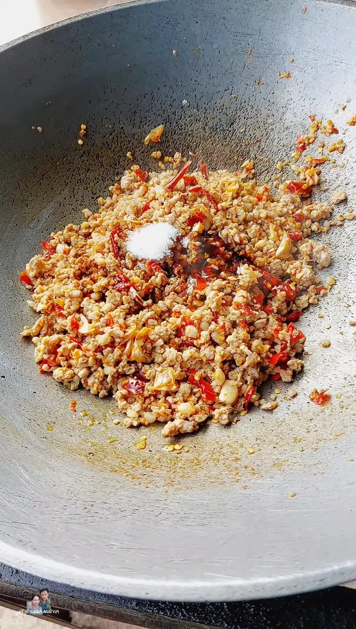 Add holy basil leaves and stir-fry until wilted and fragrant. Add more sweetener or sugar if desired.