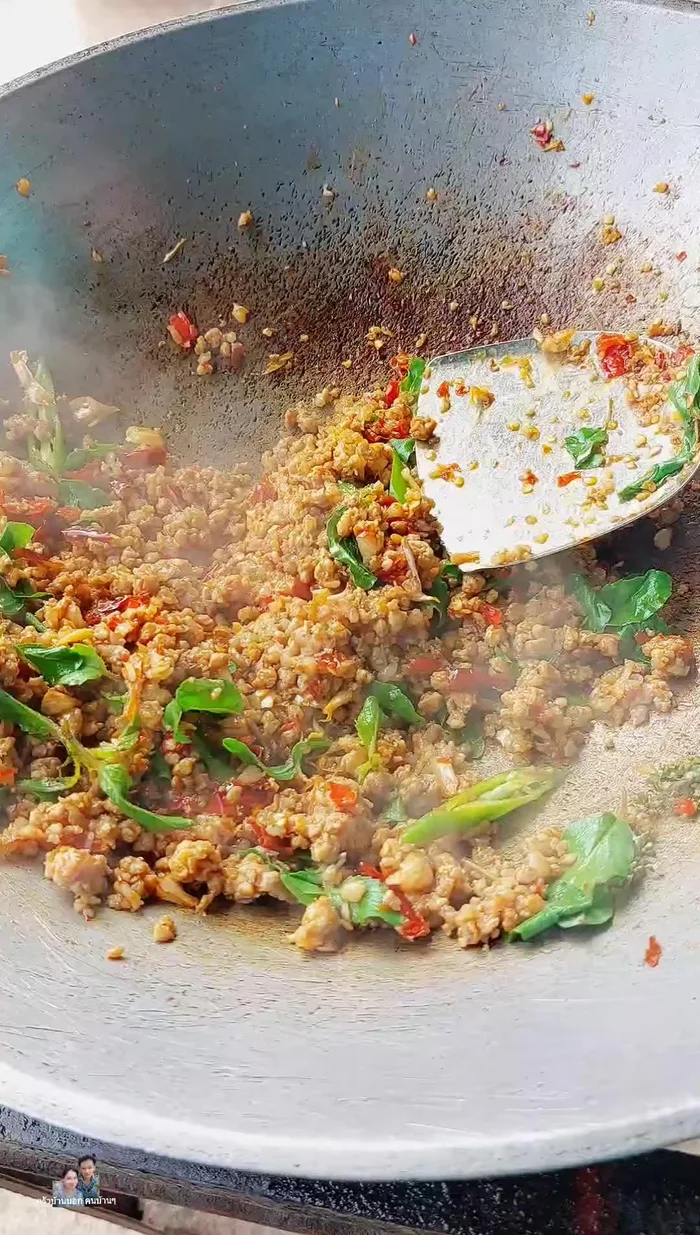 Stir-fry until the basil is cooked and the flavors are combined.