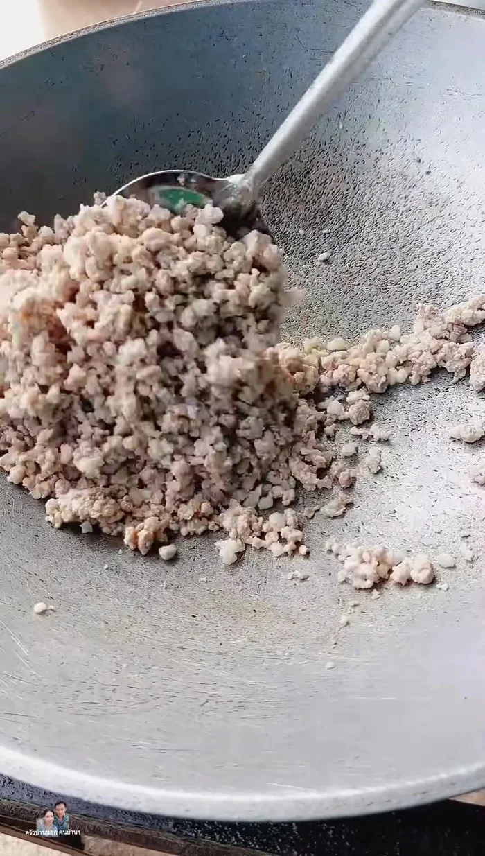 Stir-fry the minced pork in the water until dry. This helps prevent sticking.