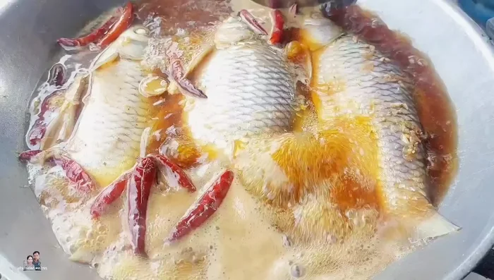 Cover the pot with a lid or steamer lid to help the fish cook quickly and puff up.