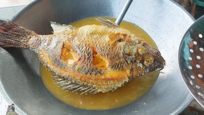 Remove the fish from the pan and set aside. The oil can be reused after the flour settles.