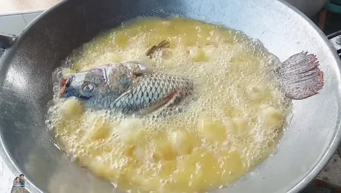 Fry the fish until golden brown on both sides.