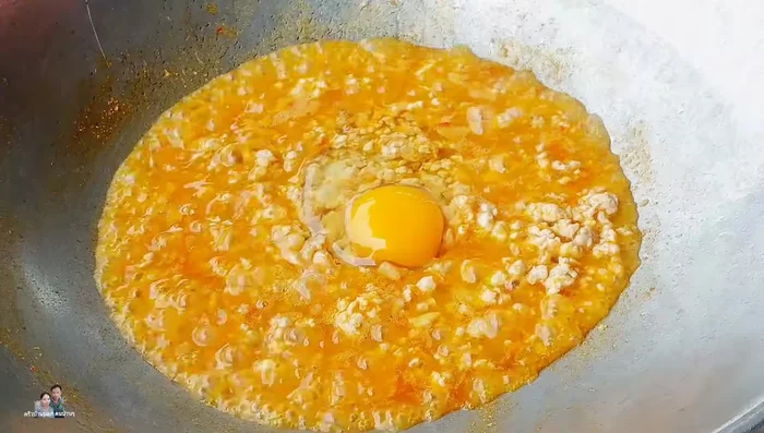 Add 1 egg and mix until cooked. Sprinkle with chopped green onions.