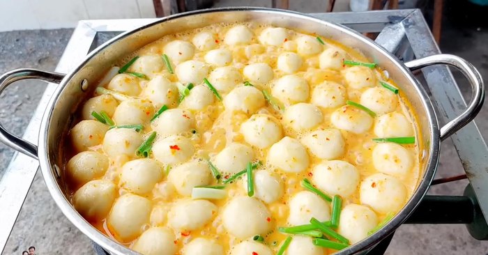 Add spring onions and stir.