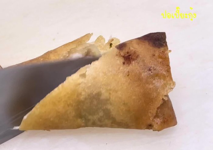 Assemble the spring rolls: Arrange shrimp, noodles, vegetables, and herbs on the rice paper wrapper. Roll tightly.