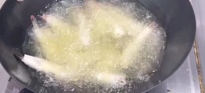 Soften the rice paper wrappers in warm water.