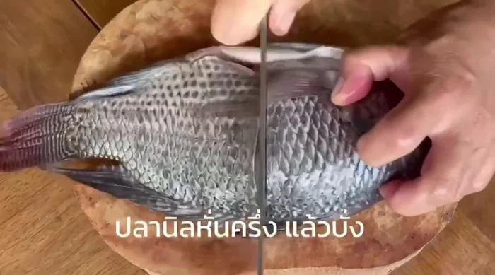 Pour in water to cover the fish. Add fish sauce and palm sugar to taste.