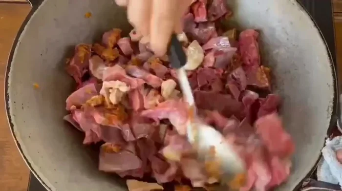 Simmer until the sauce has thickened to your desired consistency. [This step is inferred from the video and common Aom Kreuang Nai Moo preparation.]