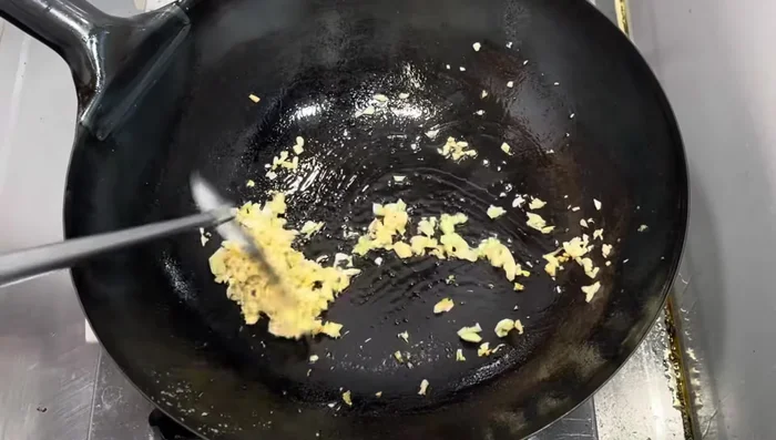 A step possibly related to checking doneness or adjusting seasoning