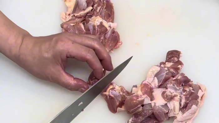 Prepare the chicken and herbs. (This step is implied by the music and lack of specific instructions in the transcript)
