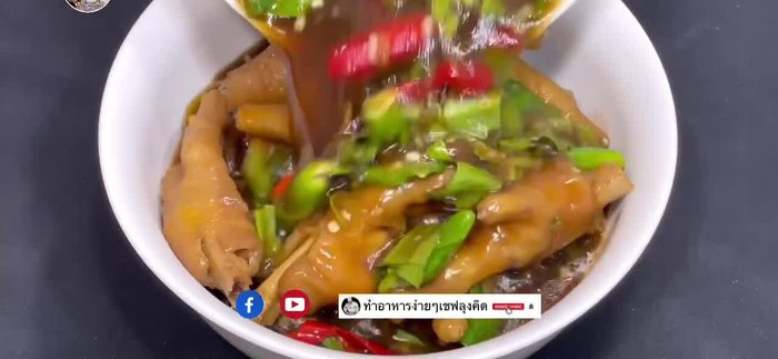 Marinate the chicken feet with soy sauce, fish sauce, sugar, garlic, chili, and other spices. (This step is implied by the audio)