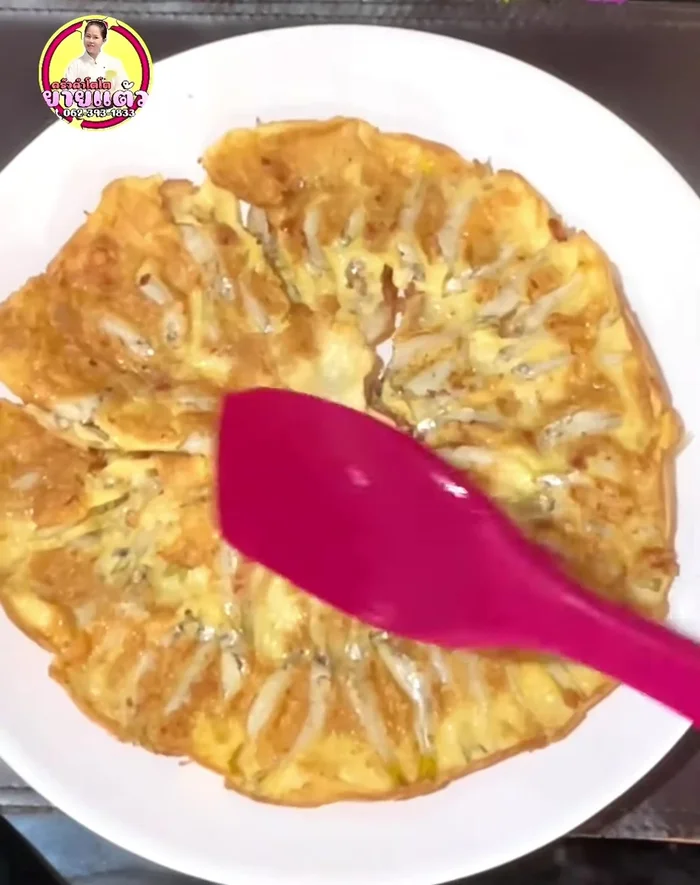 Serve the omelet on a plate.