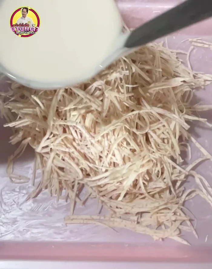 Coat the taro: Pour the prepared batter over the taro slices and mix gently to coat.