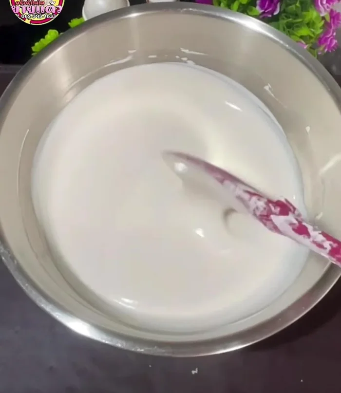 Dip the bread into the flour batter, ensuring all four sides are coated.