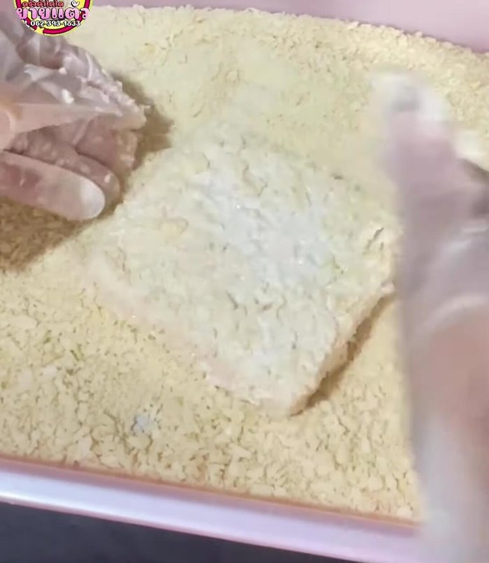 Coat the bread with breadcrumbs, pressing gently to ensure they adhere.
