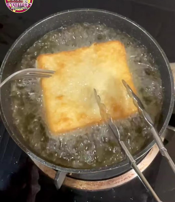 Fry the bread until golden brown on both sides, turning once the bottom is yellow. Remove crumbs from the pan between frying each sandwich to prevent burning and maintain crispiness.