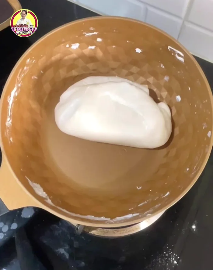 Transfer the dough to a bowl and let it cool slightly.
