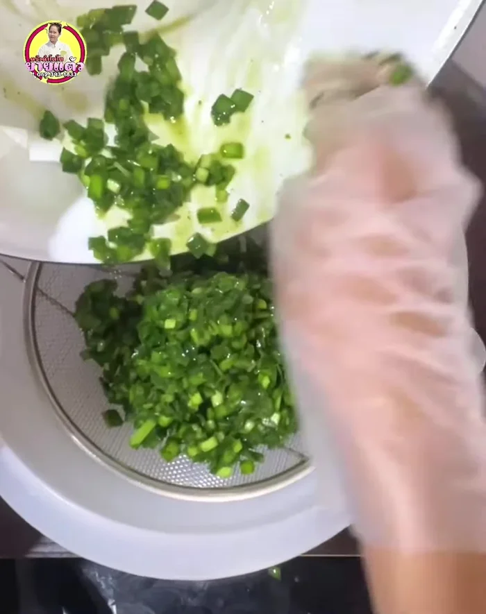 Strain the chives mixture to remove excess water.