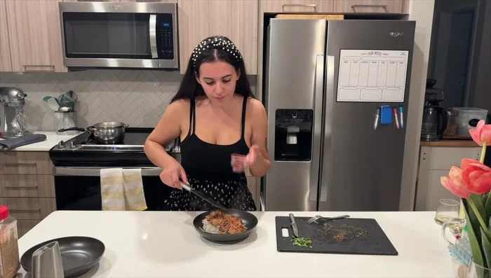 Serve the noodles, top with chicken, sauce, sesame seeds, scallions, and remaining sauce.