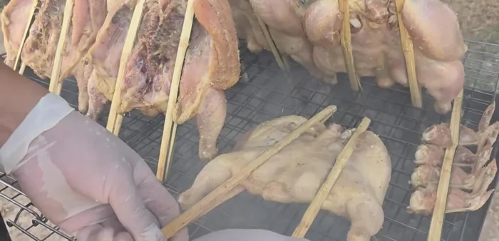 Grill the chicken: Grill the chicken over low heat, turning frequently, until the skin is tight and golden brown. Brush with the reserved garlic oil towards the end.