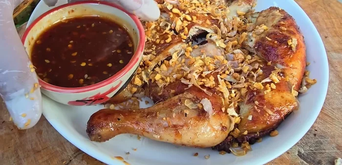 Serve: Garnish with fried garlic. Serve with sticky rice and/or papaya salad and dipping sauce.