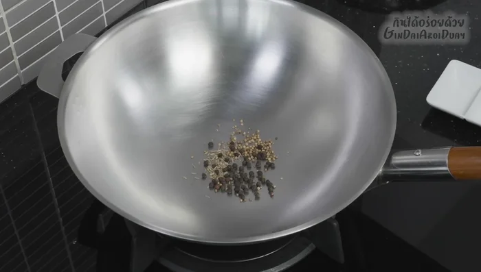 Grind the roasted spices in a mortar and pestle until fine (85.72). Add shallots and garlic and pound them together (102.439).