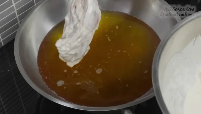 Fry the chicken: Heat oil in a pan over medium-high heat (633.24). Coat the marinated chicken in the batter (417.879). Carefully place the chicken in the hot oil, avoiding overcrowding (644.56). Fry until golden brown and cooked through, about 8-10 minutes per side, turning occasionally (676.6).