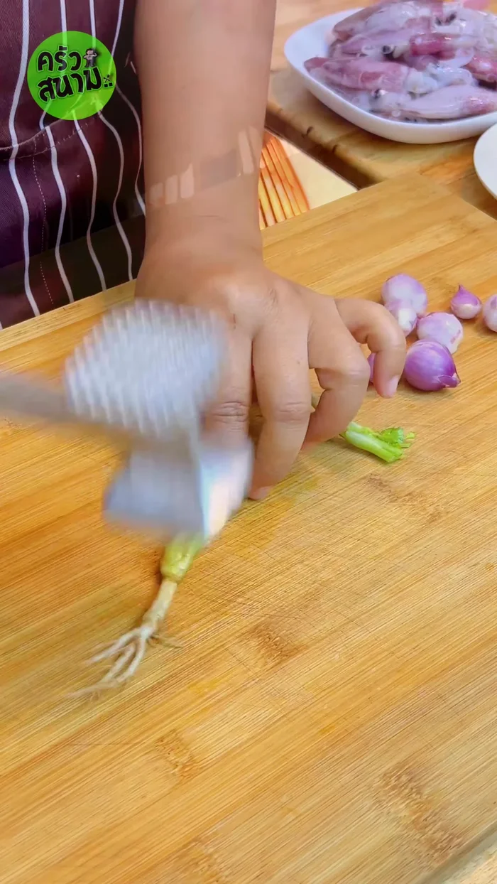 Prepare the aromatics: 3 coriander roots, 8 crushed shallots, 1 teaspoon of white peppercorns, and 5 torn kaffir lime leaves.