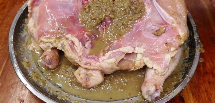 Roast the marinated chicken. (Note: Oven temperature and roasting time are missing.)
