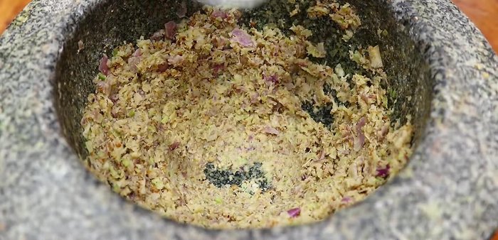 Marinate the chicken with herbs, garlic, fish sauce, soy sauce, sugar, salt, and pepper. (Note: Exact quantities and marinating time are unavailable.)
