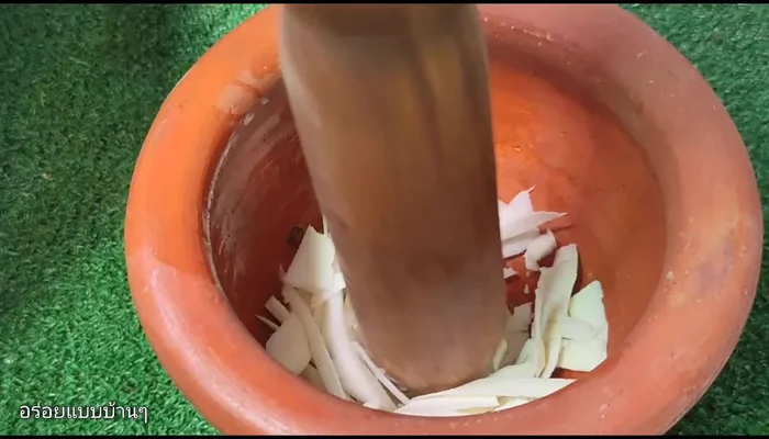 Process the cassava. Finely chop the cassava using a mortar and pestle, or blend it with a little water until smooth.