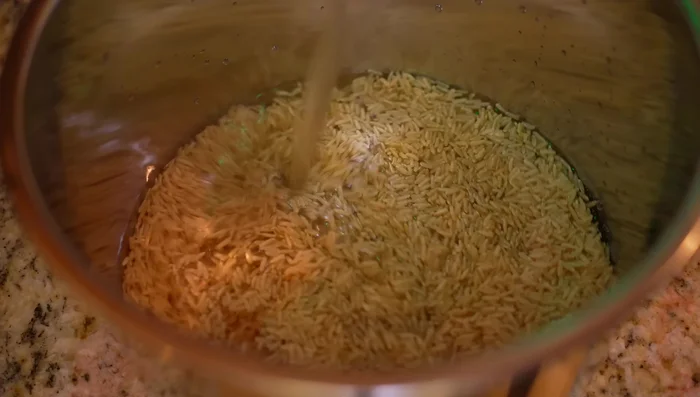 Cook rice in a rice cooker.
