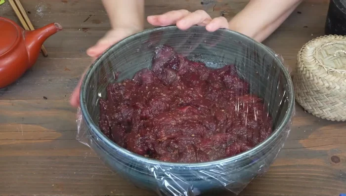 Refrigerate the marinated beef overnight.