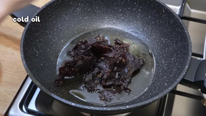 Fry the dried beef in cold oil over low heat until it reaches a beautiful mahogany color (about 17 minutes).
