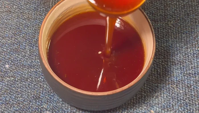 Once thickened, remove from heat and let it cool completely. The sauce will become clearer and shinier as it cools.