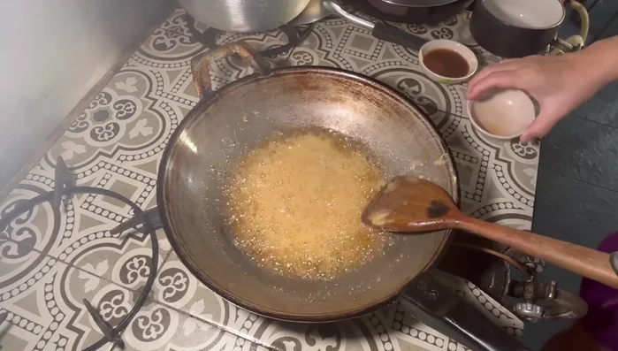 Add fish sauce and salt to taste.