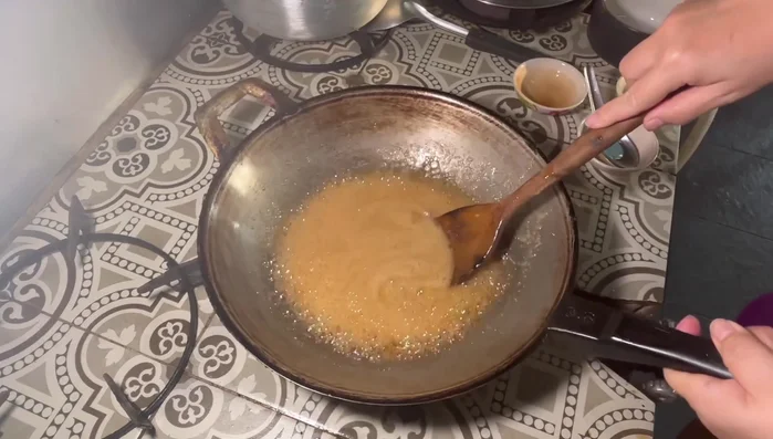 Simmer until the sauce thickens, forming large, rough bubbles. This may take some time.