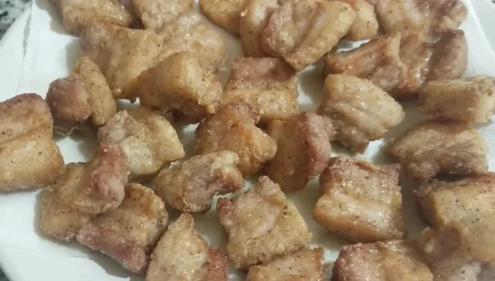 Fry the pork belly again for 1 minute until crispy and golden brown.