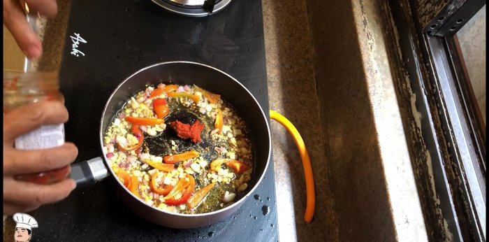 Stir in Thai red curry paste and cook until fragrant.