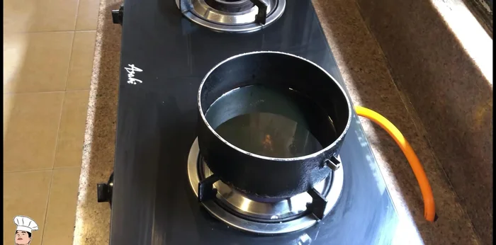 Heat oil in a deep fryer or large pot to a high temperature.